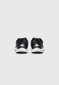 Pair of black and white Kappa sneakers shown from the back on a plain white background.