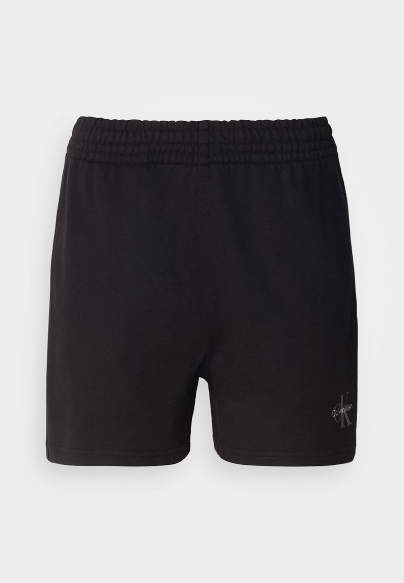 Zwarte katoenen shorts met een elastische tailleband en het Calvin Klein-logo in zilver in de rechteronderhoek. Gladde textuur.