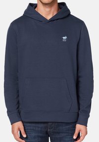 Navy blue hoodie made of cotton blend, featuring a front pouch pocket and a small embroidered logo on the chest. Soft texture, casual design.