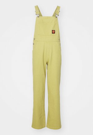 Yellow denim overalls with adjustable metal straps, a front chest pocket, and two side pockets. Flared leg design with plain texture.