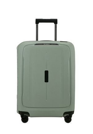 Hartschalenkoffer in Hellgrün mit strukturierter Oberfläche, ausziehbarem schwarzem Griff und vier schwarzen Rollen für optimale Beweglichkeit.