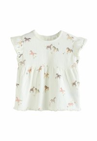 Blouse légère de couleur crème avec une surface texturée, des manches froncées et un motif équin dans des teintes pastel. Présente un ourlet froncé.