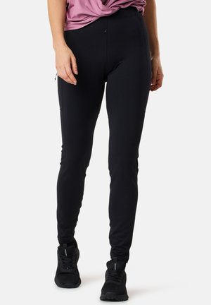 Black fitted leggings made from stretchy material with a smooth texture, featuring a side zipper pocket and subtle seam detailing.
