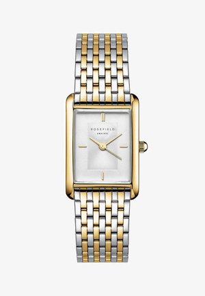 Montre rectangulaire avec un bracelet en métal argenté et doré, un cadran blanc texturé et des index horaires minimalistes. Nom de la marque "ROSEFIELD" affiché.