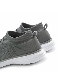 Athletic shoes with a textured grey knit upper and elastic collar, featuring a white sole and small pull tab at the back for easy wear.