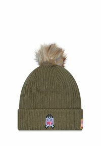 Olive green knitted beanie with a faux fur pom-pom, featuring an NFL logo patch and a small flag accent on the cuff.