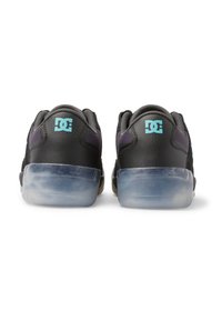 Pair of black DC sneakers with translucent blue soles, shown from the back on a white background.