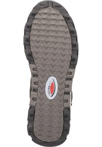 Shoe sole featuring a textured, zigzag pattern in gray and black, with a noticeable red and white logo in the center.