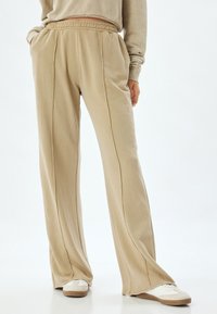 WIDE LEG - Trainingsbroek - beige