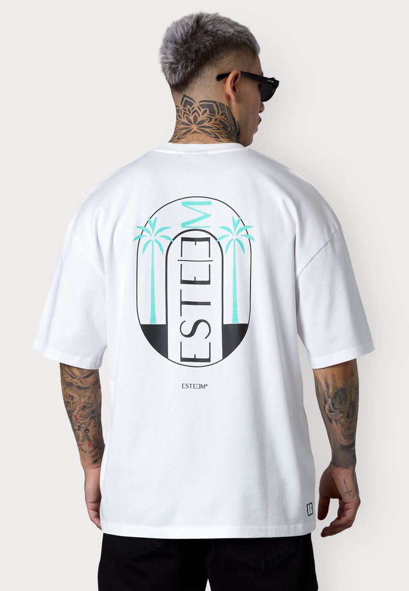 White cotton t-shirt featuring a large graphic on the back with the word "ESTEEM" and stylized palm trees in teal and black.
