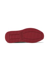 Red rubber outsole with textured ridges, featuring "Reebok" logo. Curved heel and flat bottom for traction.