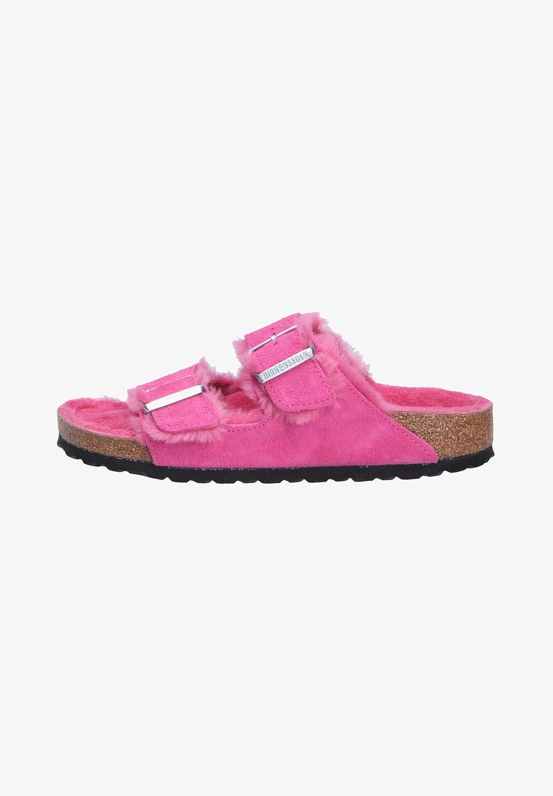 Fuzzy pink slide sandal with two adjustable straps, suede-like upper material, cork footbed, and textured black rubber outsole.