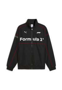 Sort letvægtsjakke med røde detaljer, høj krave, lynlås lukning og "Formula 1" logoet iøjnefaldende på forsiden.
