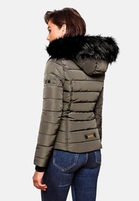 Olive green puffer jacket with elastic cuffs, a black faux fur hood, and horizontal stitching. Features a logo patch at the back.