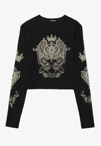 Zwarte crop top met lange mouwen van ribbeltextuur. Beschikt over ingewikkelde gouden grafische ontwerpen van kronen en rozen aan de voorkant en op de mouwen.