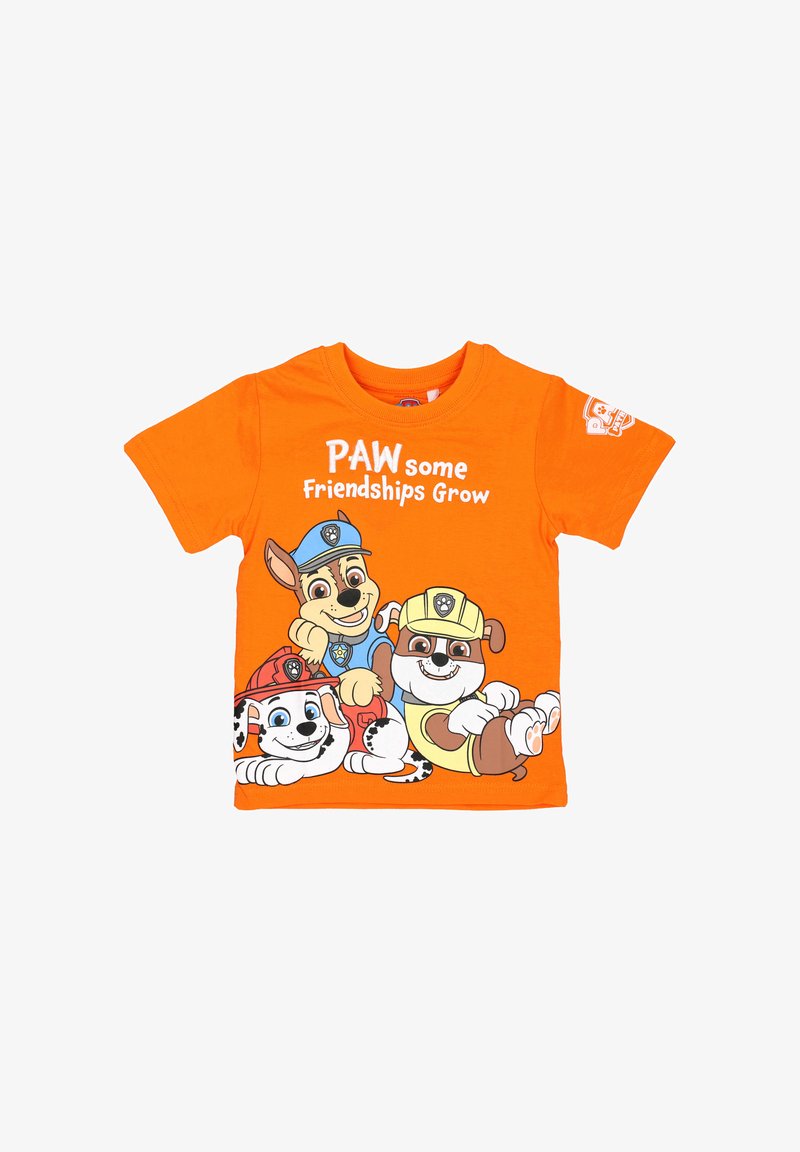 Orange cotton t-shirt featuring three cartoon dogs. Text reads "PAW some Friendships Grow." Short sleeves and crew neckline.