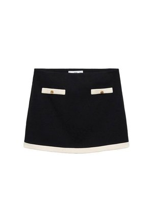 Jupe noire avec bordure blanche et deux poches avant. Dotée de boutons dorés sur les poches. Tissu lisse avec un design ajusté et structuré.