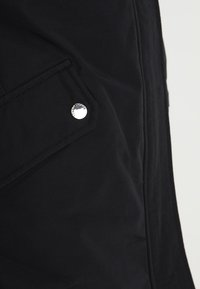 Tommy Jeans Abrigo de plumas - black