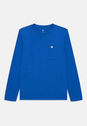 Langermet T-skjorte i livlig blå bomull. Har rund hals, rett nederkant og en liten lomme på venstre bryst med logo-merke.