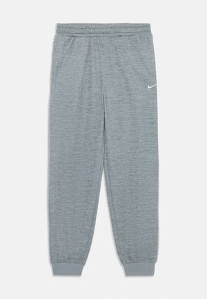 Joggers suaves de punto gris con cintura y puños elásticos. Presentan un pequeño logo blanco de Nike en la parte superior izquierda.