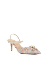 Heeled slingback shoe made of pastel tweed with floral embellishments, pearl accents, and a pointed toe design. Soft neutral strap.