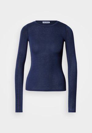 Top azul marino de manga larga hecho de material ligero y ligeramente transparente. Presenta un escote redondo y una silueta ajustada.