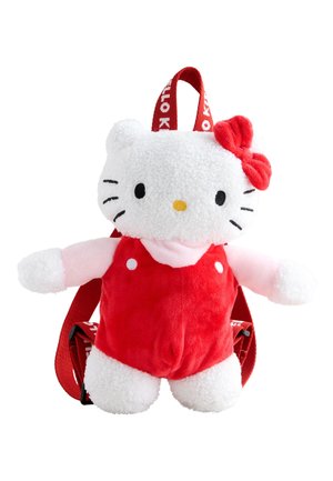 White plush cat backpack with red straps, a red dress, pink sleeves, and a red bow on its head.