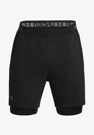 Bermudas atléticas negras con una capa interior ajustada, cinturilla elástica con el nombre de la marca y tejido suave y ligero.