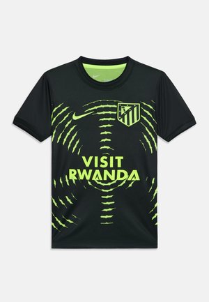 Crni nogometni dres s uzorkom neon zelenih krugova, logo Nike, grb Atletico Madrida i tekst "Visit Rwanda" sprijeda.