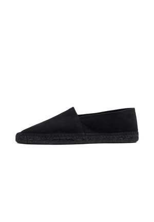 Black slip-on espadrille shoe with a flat woven sole, soft upper, and angled vamp, shown in side profile on a white background.