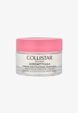 Collistar tiefenfeuchtigkeitsspendende Creme in einem klaren Glasbehälter mit einem pinken Deckel. Etiketten in Schwarz und Weiß an der Seite des Behälters. Cremige Textur ist innen sichtbar.
