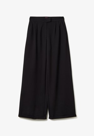 High-waist wide-leg black trousers with side pockets, front pleats, and a concealed front fastening, made from smooth fabric.
