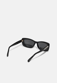 Swarovski Päikeseprillid - black