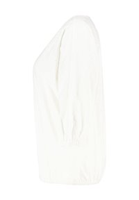 Weiße Bluse mit langen Ärmeln, die über geraffte elastische Manschetten und ein strukturiertes Muster an den Ärmeln verfügt. Sie hat eine lockere Passform und besteht aus weichem Stoff.