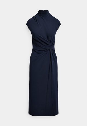 Navy blue sleeveless dress with high neckline, gathered design, and draped detailing, made from smooth fabric; knee-length silhouette.