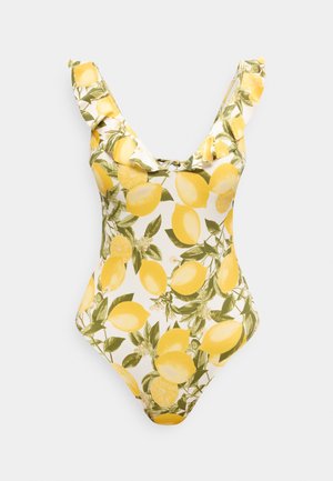 Ολόσωμο μαγιό με εκτύπωση λεμονιών και πράσινα φύλλα, ραμμένα βολάν στα λουράκια και μικρή λεπτομέρεια με δέσιμο μπροστά.