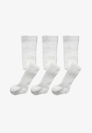 Four white socks: two are knee-high with a smooth texture, and two are crew-length with a ribbed pattern. All are made of soft fabric.