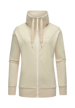 Haut de sweat à capuche beige zippé avec un col haut, des manches longues et des cordons texturés. Présente un logo discret sur la poitrine. Tissu doux.