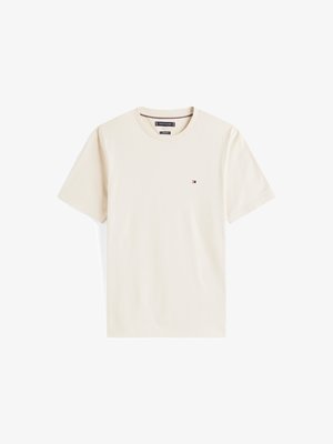 Bež majica od pamuka s okruglim izrezom i kratkim rukavima. Ima mali logo na lijevoj strani prsiju. Glatka tekstura, ležerni dizajn.