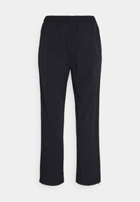 Schwarze Freizeithose mit elastischem Bund, geraden Beinen und leicht zerknitterter Textur, dargestellt vor weißem Hintergrund.