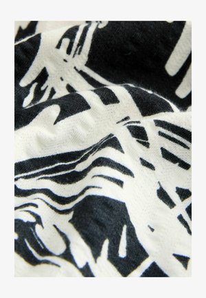 Fekete és fehér absztrakt mintázatú textil, lágy tapintással, hullámos felülettel és változó vastagságú vonalakkal.