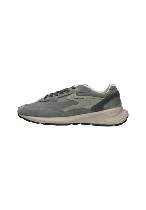 Zapatilla deportiva gris y negra con suela beige gruesa, cierre de cordones en el frontal y logotipo "HOFF" en el lateral.