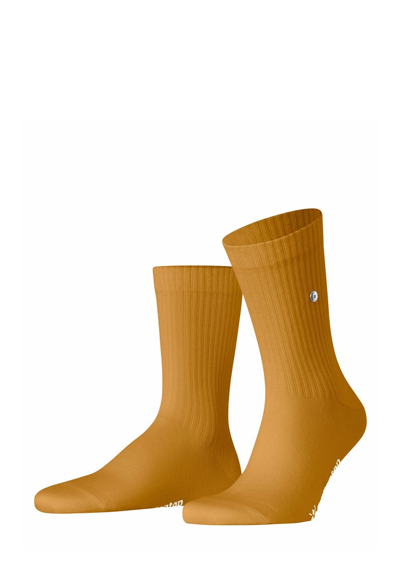 Calze gialle a coste con un orlo aderente e punta rinforzata. Presentano un piccolo logo vicino alla caviglia. Il materiale sembra liscio ed elastico.
