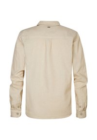 Lichtbeige langemouwen shirt met een subtiele textuur, knoopmanchetten en een achterste yoke-detail, met een kraag en geen zichtbare patronen.