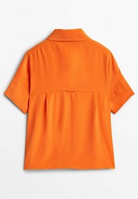 Orange short-sleeve shirt with a collared neck, featuring a gathered back design and smooth fabric texture.