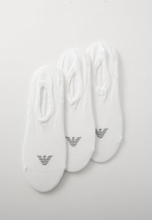 Three pairs of white ankle socks made of soft cotton, featuring a striped logo in grey on the toe area and a seamless design.