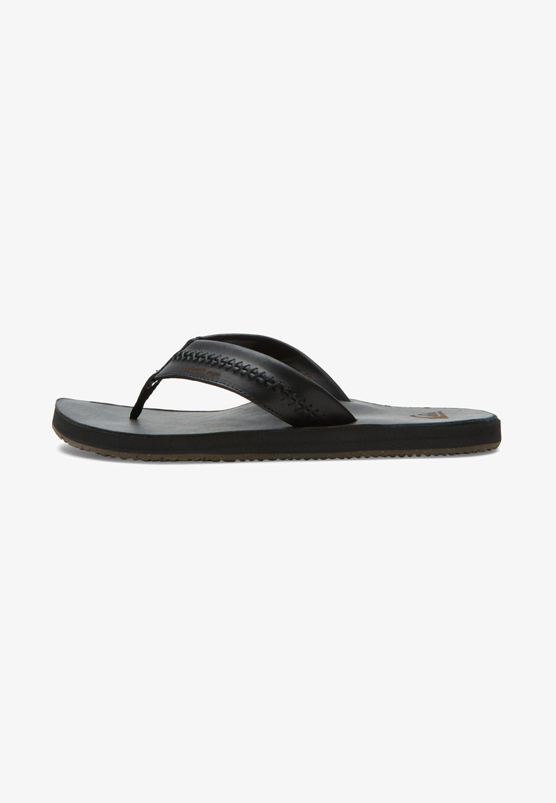 Melni flip-flopi ar teksturētu ādas augšdaļu un plakanu gumijas zoli. Izsmalcinātas siksnas ar izšūta apdari un veidotu zoles daļu.