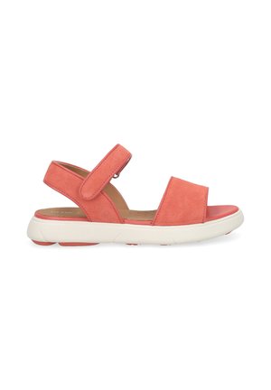 Coral pink sandal with suede straps, adjustable ankle strap, cushioned tan footbed, and thick white rubber sole for casual wear.