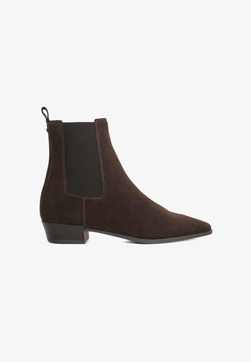 Brown suede ankle boot with elastic side panels, pointed toe, low block heel, and contrasting stitching detail. Clean, minimalist design.
