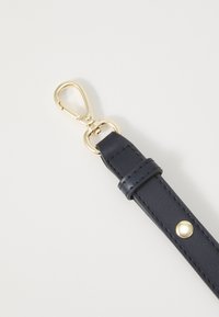 Tommy Hilfiger FLAP CROSSOVER - Handbag - space blue